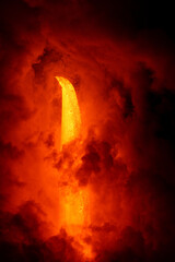 Wall Mural - Lava tube flowing into ocean in Hawaii creates massive explosions as the lava hits seawater at night