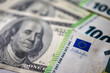 © Jurii - 100 dollar bills and 100 euro bills close-up symbolize wealth, international finance, currency exchange and world economy, world currency market, competitors