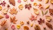 © VisualVault - Autumnal Leaf Arrangement  A Colorful Frame of Dried Leaves and Acorns on a Peach Background