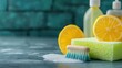 © Seyyar - Citrus cleaning essentials with soap sponge and lemon slices on textured table background for natural cleaning product advertisements