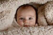 © Milos - This image captures a happy baby with a delightful smile, fully wrapped in a soft blanket, embodying joy and affection that resonates with love and warmth.