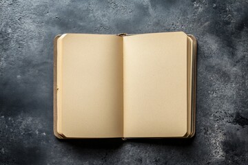 Wall Mural - a book is open to a blank page. the book is on a table. the table is made of wood