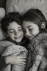 Two children cuddle warmly under a cozy blanket while enjoying a peaceful moment together in a comfortable setting