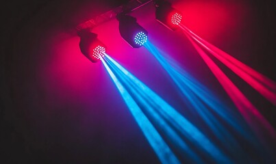 Canvas Print - Colorful stage lights emitting beams in a dark setting.