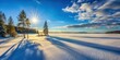 © PloyJai - Winter wonderland scene with bright sun and long shadows cast across a snow-covered frozen lake by evergreen trees.