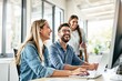 © PlanetOfVectors - Three coworkers smiling, collaborating on a project in a bright, modern office. Casual attire, cheerful atmosphere, teamwork concept. Ai generative