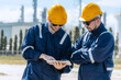 © Quality Stock Arts - Engineer teamwork, professional male workers working survey inspection at petroleum refinery outdoor