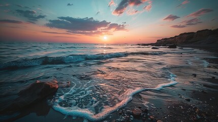 Wall Mural - majestic golden sunset over calm ocean waves on a secluded sandy shore, illuminated by vibrant eveni