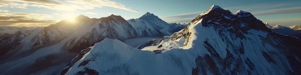 Fototapete - Aerial panorama of the snowy peaks surrounding Everest Base Camp, with dynamic shadows cast by the golden hour light, in 4K resolution