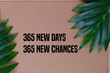 © Ardini - 365 new days, 365 new chances. Letter board with motivational quote on brown frame background with leaves. New year resolutions and goal setting, self improvement and development concept.