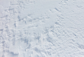 Wall Mural - A snow covered ground with a few footprints