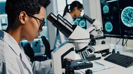 Poster - Young scientists conduct research in modern laboratory using advanced microscopes and technology to analyze samples