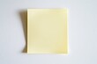 © Maria - sticky note in soft yellow shade perfectly square and flat displayed on bright white background