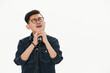 © 亮亮 徐 - Asian man singing in front of microphone against white background