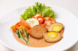 © Herman - A bowl of Indonesian traditional dish featuring galantine steak, boiled eggs, vegetables and served with sweet and sour sauce