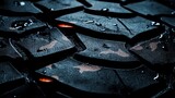 Extreme Close up of Dark Camouflage Tire Tread  Water Droplets