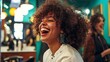 © Atthapon - A woman with curly hair is smiling and laughing in a salon