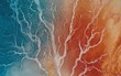 © Puchong - Abstract aerial view of a vibrant coastline where teal ocean meets rusty red land. Intricate patterns of water and earth create a striking contrast.