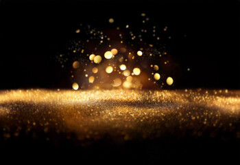 Poster - Glimmering gold sparkles and bokeh lights illuminate a dark background, creating a luxurious and festive atmosphere.  The fine gold dust adds texture and depth to the scene.