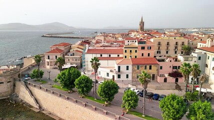 Wall Mural - Scenic drone view of Alghero's coastline and historic town during a bright summer day