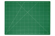© Dmytro - A big green cutting mat with a white grid is isolated.