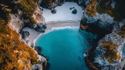 Poster - Aerial view of secluded cove, turquoise water, white sand beach, and autumnal cliffs.