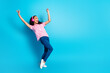 © deagreez - Full length photo of excited positive girl wear print t-shirt headphones singing empty space isolated blue color background