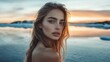 © gentho - A portrait of a young woman by a serene body of water at sunset.