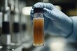 © zakiroff - Scientist Hand Holding Glass Vial with Contaminated Water Sample, Laboratory Analysis for Environmental Protection Concept