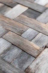 Poster - Close-up of weathered wood planks arranged in a herringbone pattern.