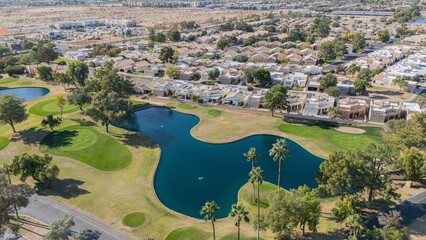 Wall Mural - Aerial view of suburban neighborhood with golf course.