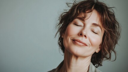 Wall Mural - Smile, eyes closed and skincare of mature woman in studio for glow, results or beauty on gray background