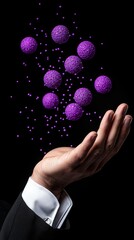 Wall Mural - a hand reaching out to a bunch of purple spheres