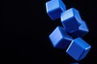 © OnuTH - Abstract Blue Cubes Falling on Black Background
