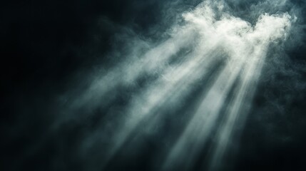 Wall Mural - a black and white photo of a cloud with rays of light coming out of it