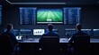 © khonkangrua - Data Analysts Monitoring Sports Match on Multiple Screens in Modern Control Room Environment