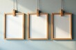 © tpadobestock - Wooden frames hanging in a row, minimalist style, decor, clean, frames