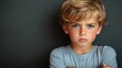 © btiger - Angry boy portrait with crossed arms upset face expression unhappy toddler frustrated emotion