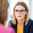 © Kowit - Office portrait of a professional woman engaging in insightful business meeting discussion