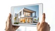 © rashyn - Hands holding tablet displaying modern house design.