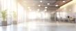 © Sana - Blurred background of office space with glass elements, green plants, sunlight and lights. Generative AI