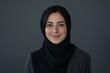 © Kristina - Portrait of beautiful woman with hijab is smiling on gray background