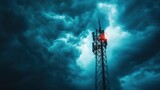 Cell tower against a stormy sky.