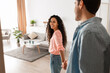 © Prostock-studio - Follow Me. Portrait of happy lady inviting guy to enter home, welcoming to living room, happy smiling woman holding man's hand showing new modern apartment and living room, selective focus