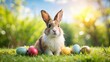 © udomsak - Cute rabbit bunny sitting on grass with colorful Easter eggs in a sunny outdoor setting, Easter, holiday, spring, celebration, fluffy