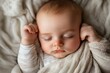 © LifeMedia - Peaceful slumber of a baby in a cozy and soft blanket during a serene afternoon