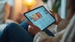 © Sinechana - 19.A person reading an online news article on a tablet in the morning, with the screen showing a digital newspaper or magazine interface. The latest news is visible, and the persons happy expression