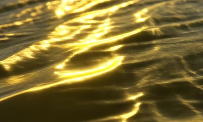 Wall Mural - Golden Hour Water Reflections: A Close-Up View of Sunlit Waves