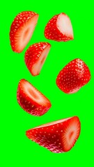 Wall Mural - Colorful strawberries floating against a bright green background with creative imagery