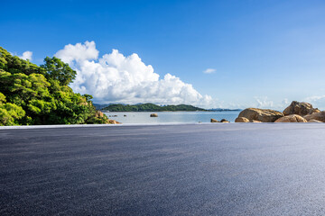Wall Mural - asphalt road and beautiful coastline nature landscape under blue sky. road by the sea.